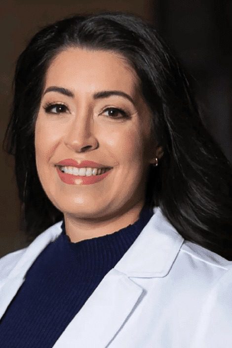 headshot of a woman wearing a white coat